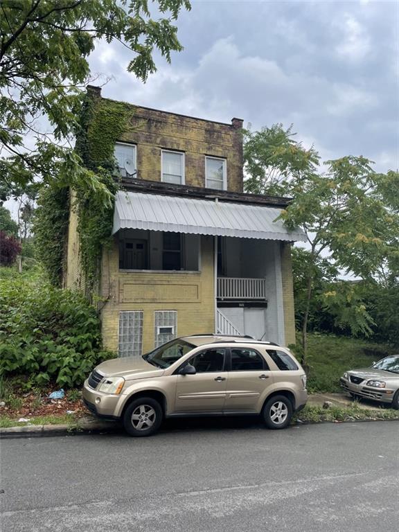 620 Kirkpatrick Street Pittsburgh, PA 15219 - Photo 1 of 8 a car parked in front of a house