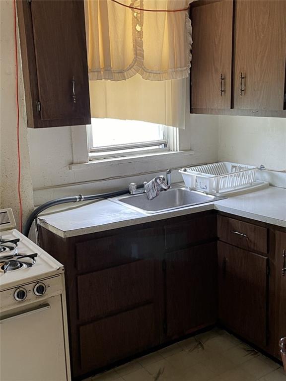 620 Kirkpatrick Street Pittsburgh, PA 15219 - Photo 2 of 8 a kitchen with a sink stove and cabinets