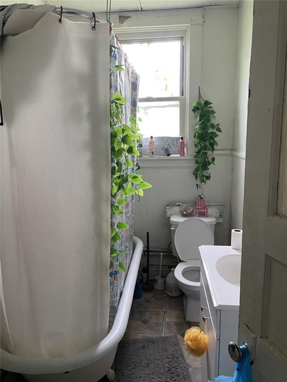 620 Kirkpatrick Street Pittsburgh, PA 15219 - Photo 6 of 8 a white toilet sitting next to a window