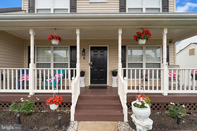a view of a chairs and deck in the patio