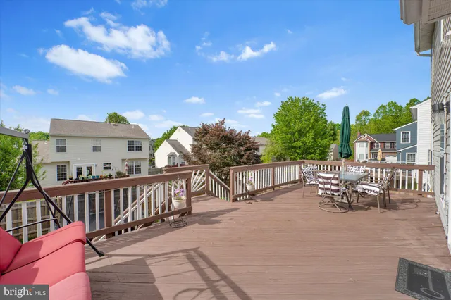 a view of a chairs and tables in the balcony