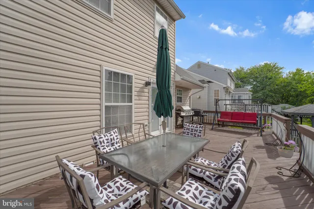 a view of a house with swimming pool and yard
