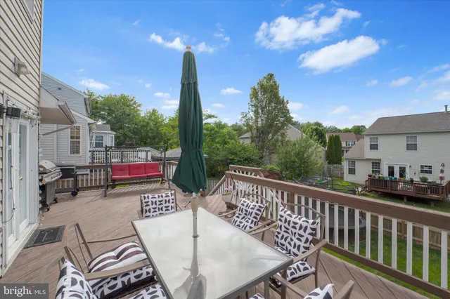a view of a chairs and table in backyard of the house