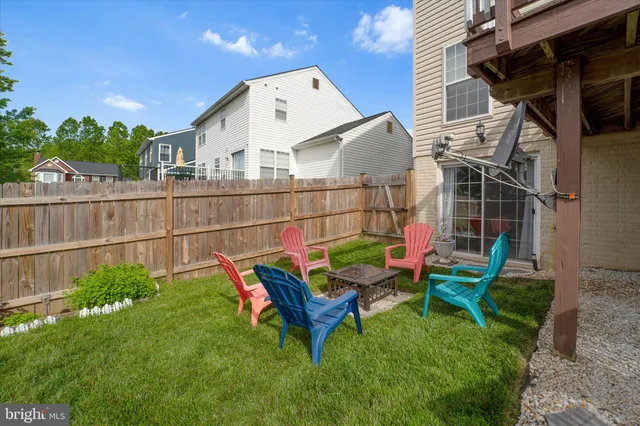a view of a house with a yard and deck