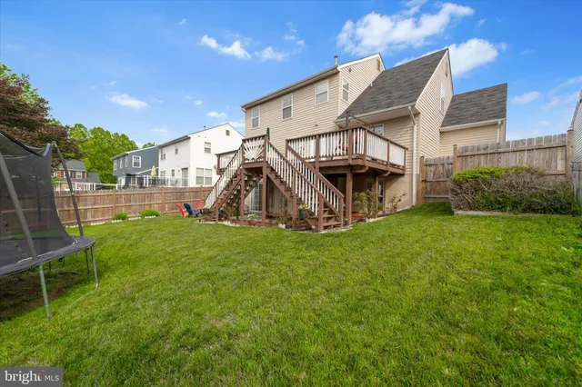 an aerial view of a house with outdoor space