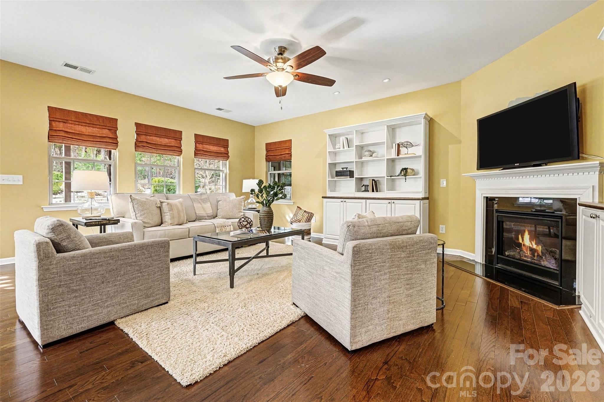 2192 Winhall Road Fort Mill, SC 29715 - Photo 12 of 32 a living room with furniture fireplace and flat screen tv