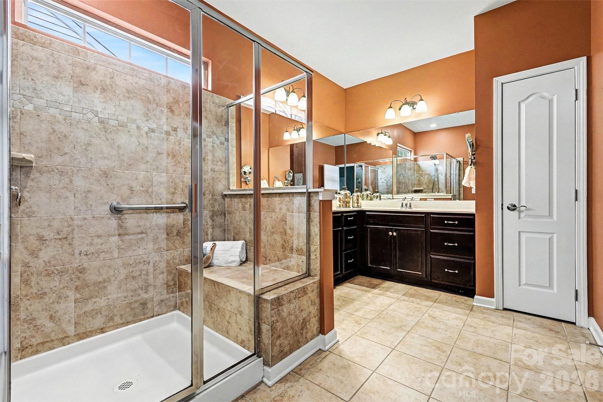 2192 Winhall Road Fort Mill, SC 29715 - Photo 17 of 32 a bathroom with a granite countertop sink and a bathtub