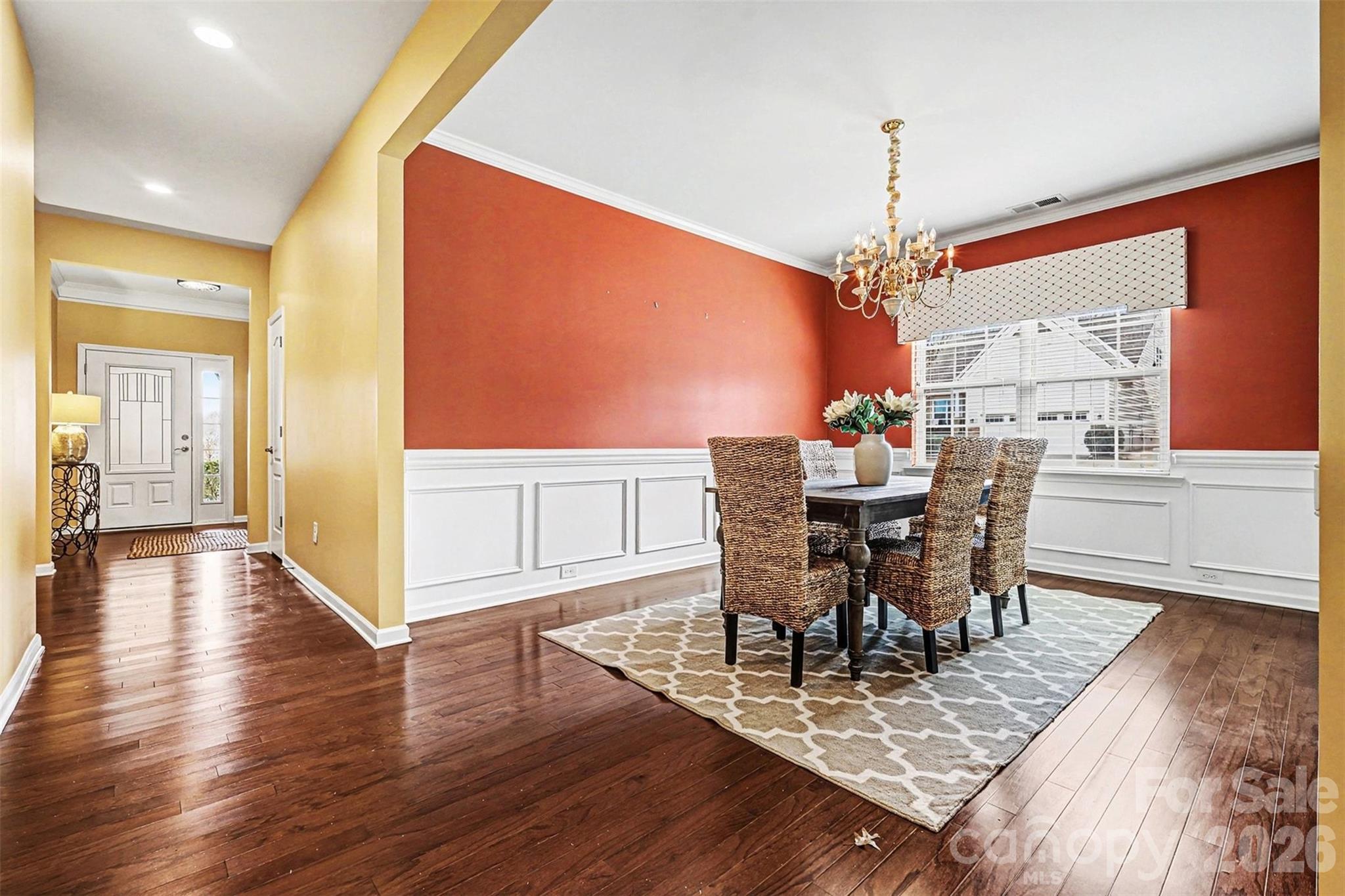 2192 Winhall Road Fort Mill, SC 29715 - Photo 3 of 32 a view of a dining room with furniture and wooden floor