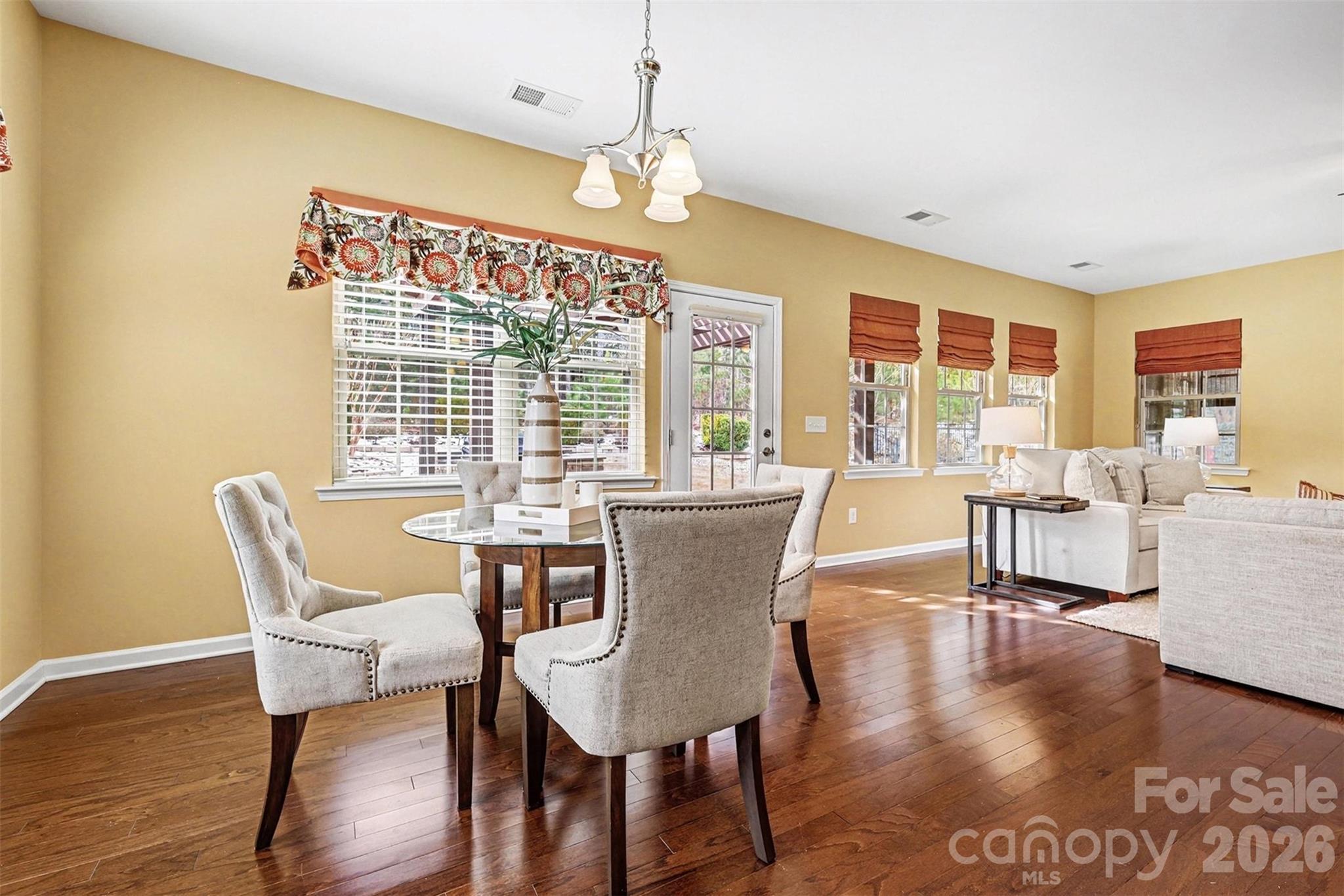 2192 Winhall Road Fort Mill, SC 29715 - Photo 10 of 32 a view of a dining room with furniture window and wooden floor