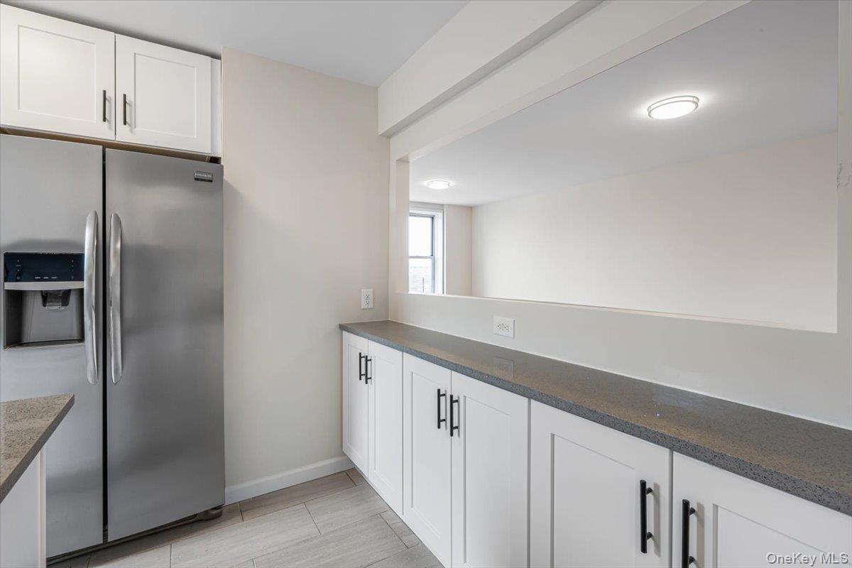 59-30 108th Street, Unit 6D Queens, NY 11368 - Photo 16 of 23 a kitchen with a refrigerator and a sink