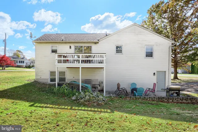 a view of outdoor space with deck and yard