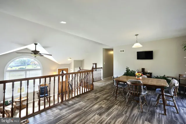 a view of a dining room with furniture window and wooden floor