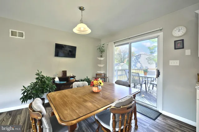 a kitchen with granite countertop a sink stove and cabinets
