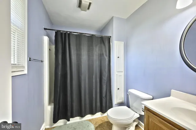 a bathroom with a toilet and a sink