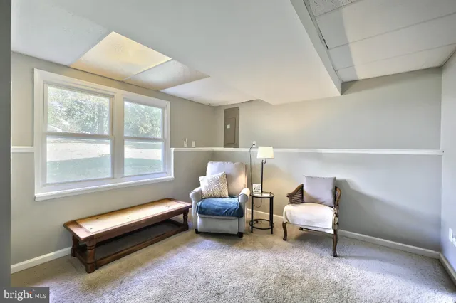 a view of a livingroom with couch and cabinet
