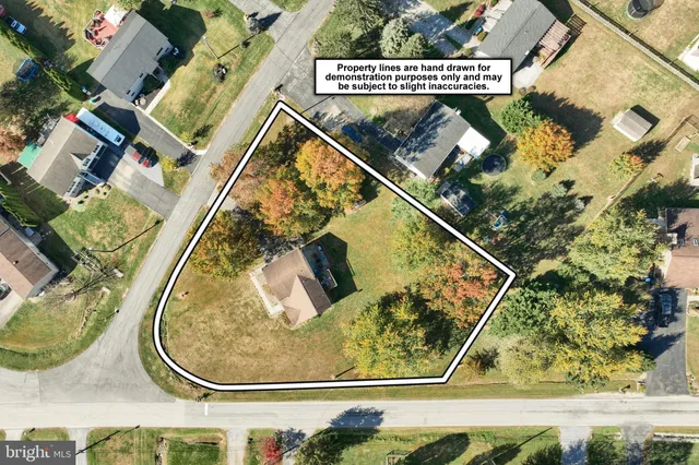 an aerial view of a house with swimming pool