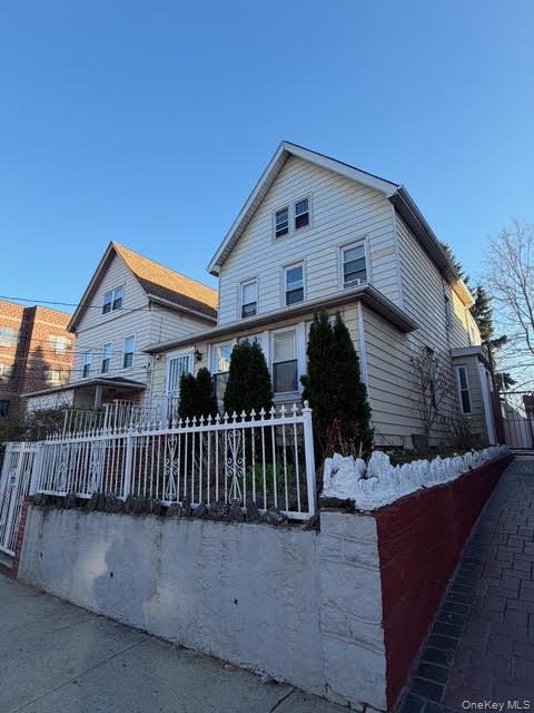 686 East 239th Street Bronx, NY 10470 - Photo 1 of 30 a view of a house with wooden fence