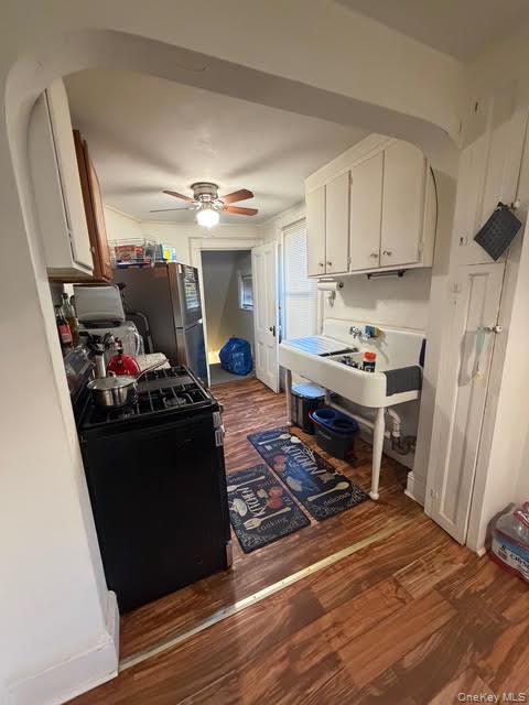 686 East 239th Street Bronx, NY 10470 - Photo 14 of 30 a kitchen with a stove and a refrigerator