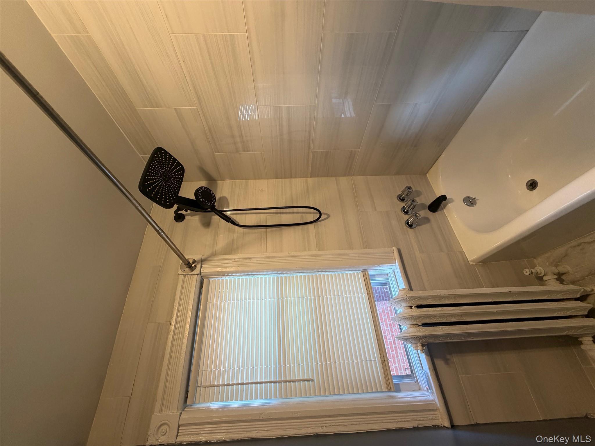 686 East 239th Street Bronx, NY 10470 - Photo 18 of 30 a bathroom with a bath tub