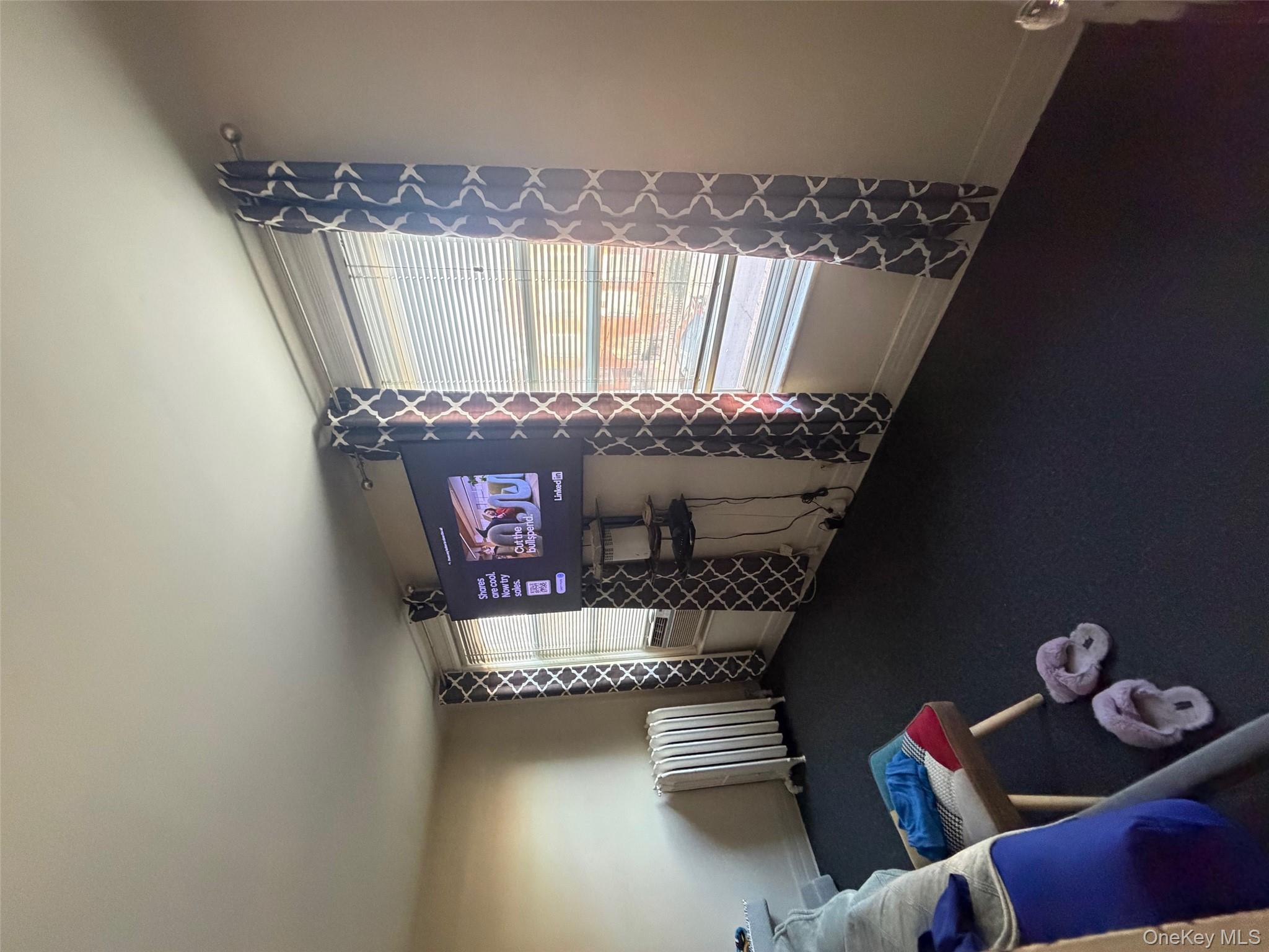 686 East 239th Street Bronx, NY 10470 - Photo 21 of 30 a living room with furniture and a window