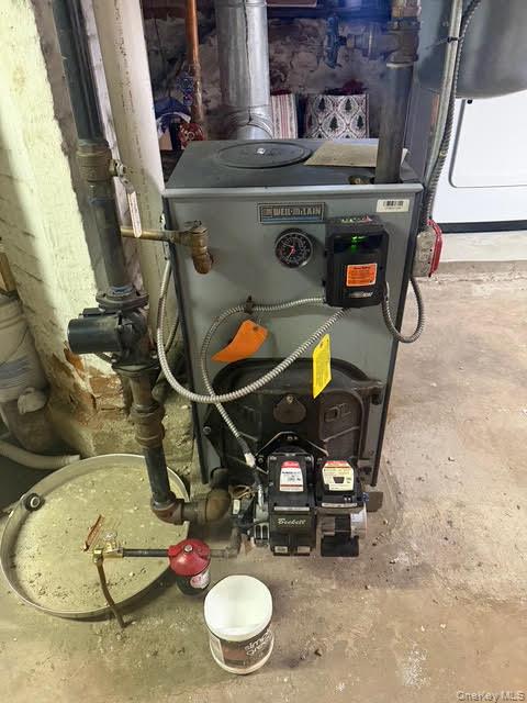 686 East 239th Street Bronx, NY 10470 - Photo 28 of 30 a stove top oven sitting inside of a kitchen
