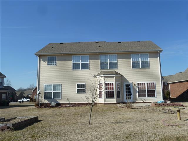 2002 Silverton Circle Spring Hill, TN 37174 - Photo 4 of 17 a front view of a house with a yard