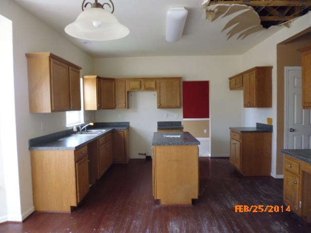 2002 Silverton Circle Spring Hill, TN 37174 - Photo 7 of 17 a kitchen with stainless steel appliances granite countertop a sink stove and refrigerator