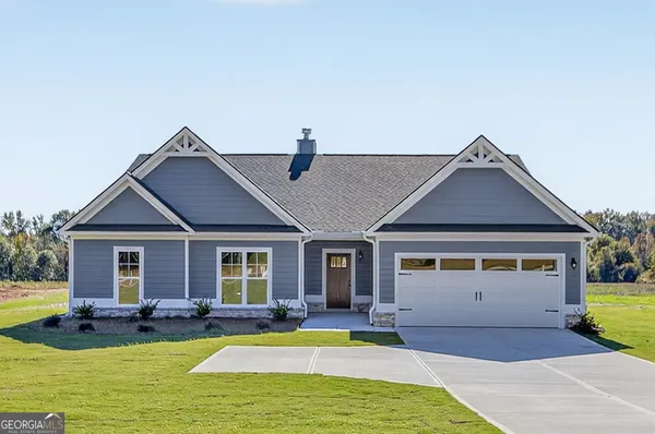 a view of a house with swimming pool and a yard