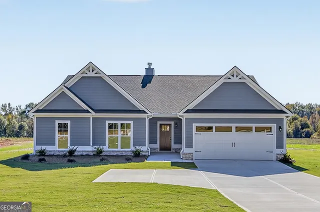 a view of a house with swimming pool and a yard