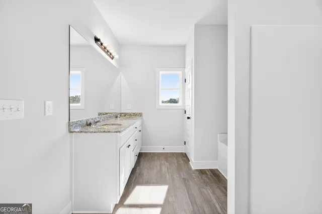 a view of a kitchen from a hallway