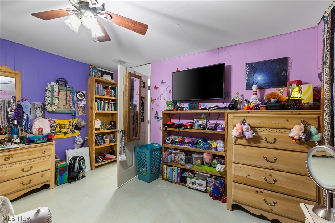 38340 Lees Run Road Cadiz, OH 43907 - Photo 15 of 31 Bedroom with a ceiling fan and concrete floors