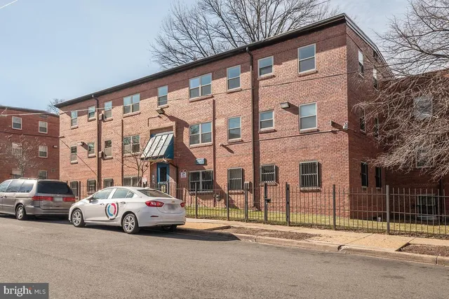 a view of a building with a swimming pool