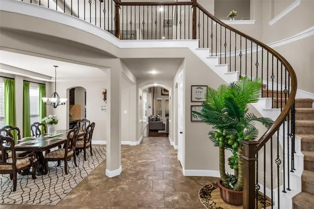 a view of hall way with furniture