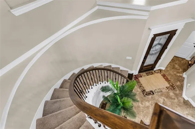 a view of staircase with wooden floor