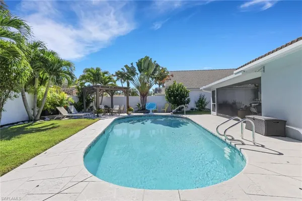 a view of a swimming pool with a yard