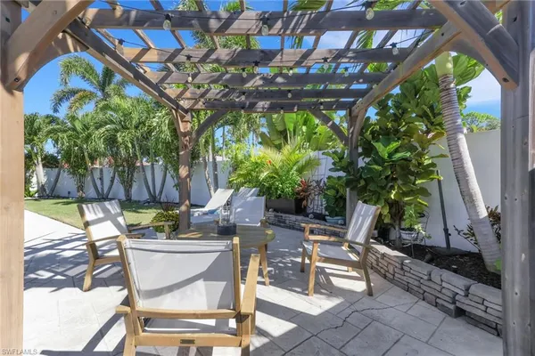a view of a chairs and table in a patio