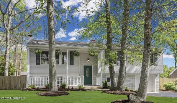 front view of a house with a garden