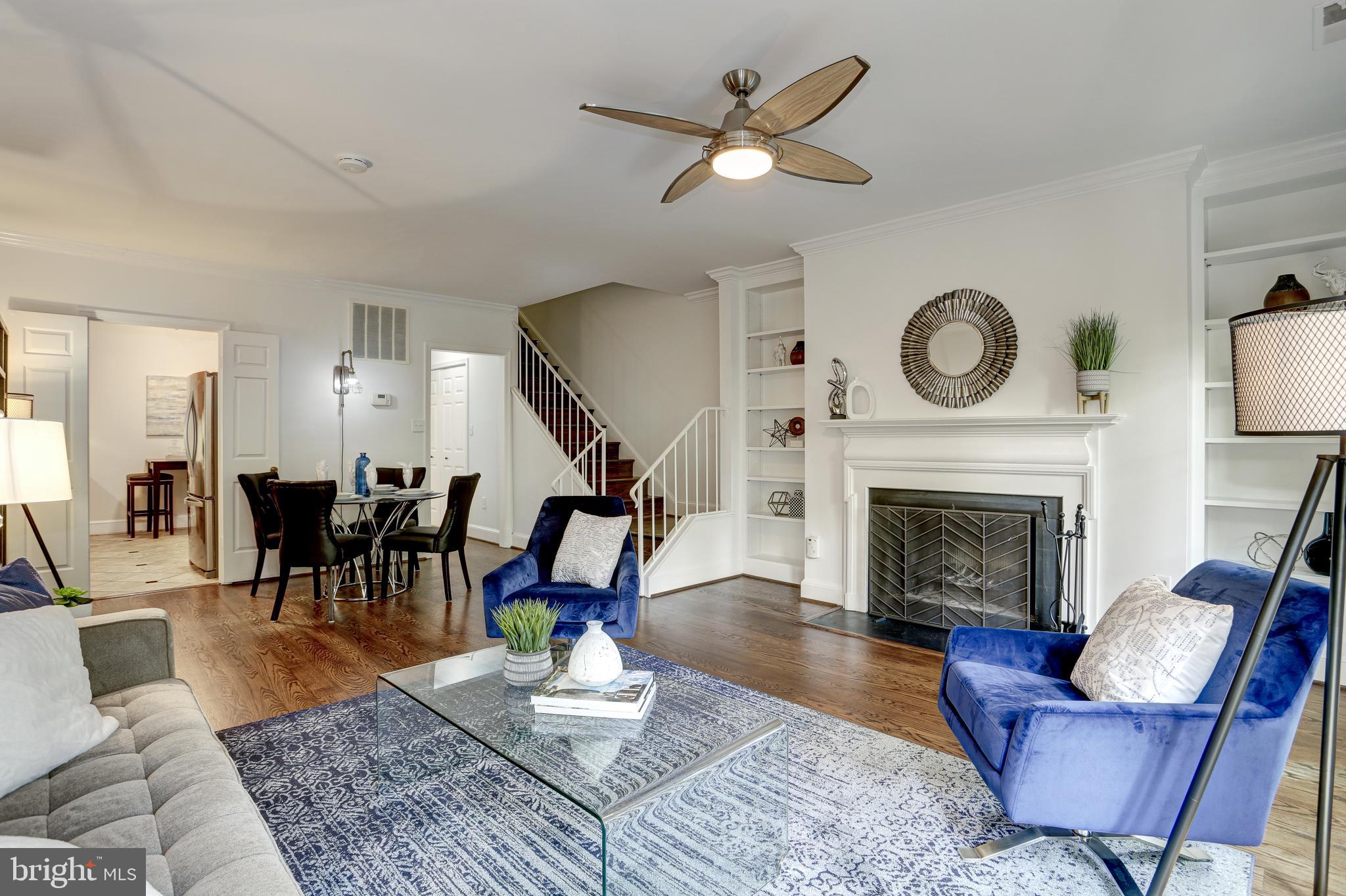 3205 Sutton Place Northwest, Unit D Washington, DC 20016 - Photo 5 of 25 Living area and fireplace