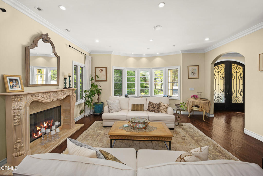 574 Camillo Road Sierra Madre, CA 91024 - Photo 12 of 72 a living room with furniture large window and a fireplace