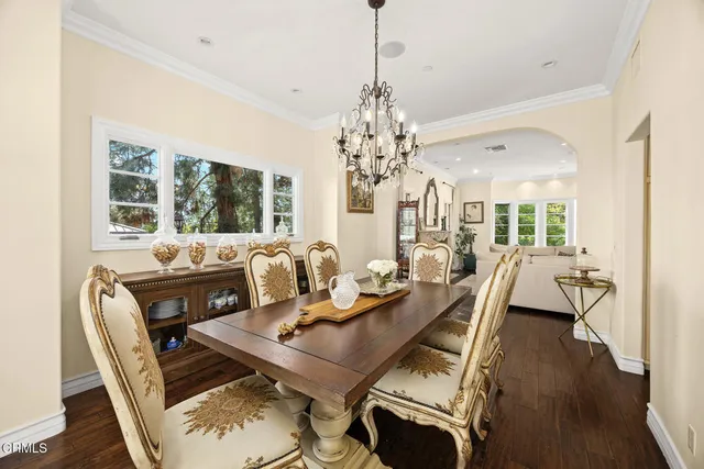 a living room with fireplace furniture and a large window