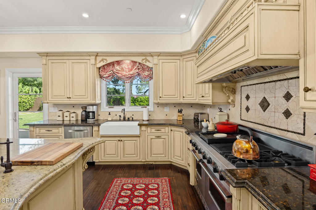574 Camillo Road Sierra Madre, CA 91024 - Photo 18 of 72 a kitchen with stainless steel appliances a stove a sink and a microwave