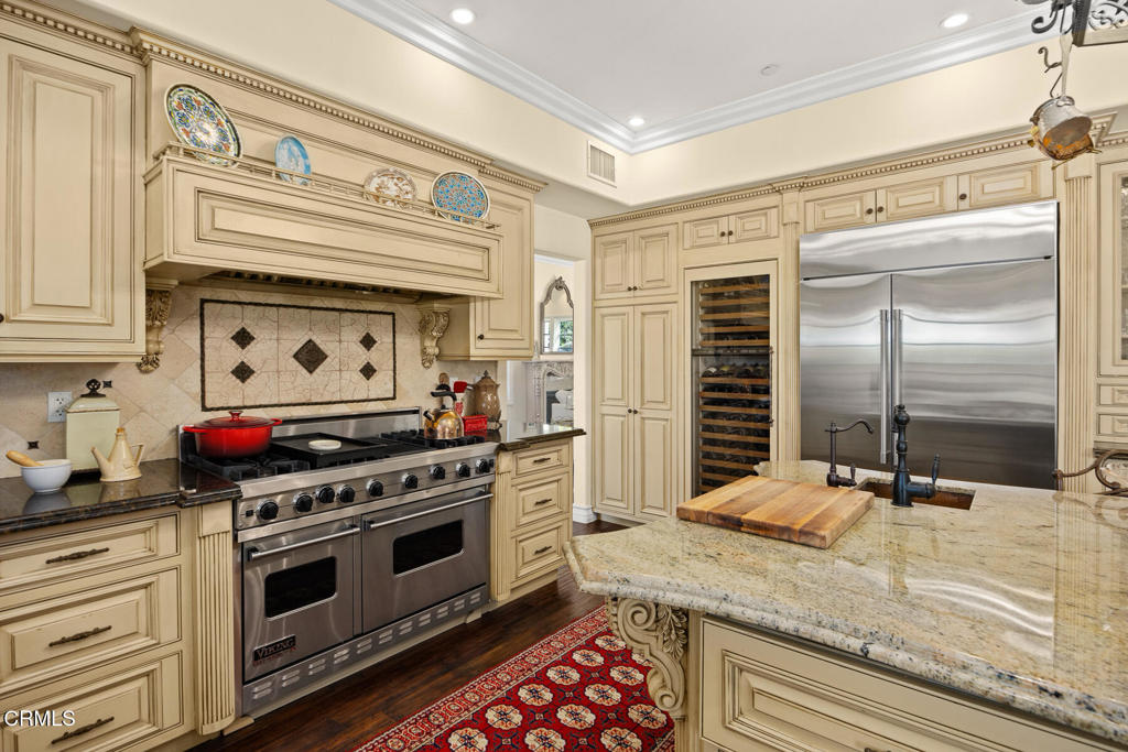 574 Camillo Road Sierra Madre, CA 91024 - Photo 20 of 72 a kitchen with stainless steel appliances granite countertop a stove and a refrigerator