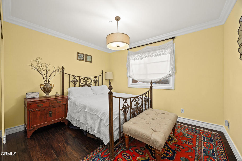 574 Camillo Road Sierra Madre, CA 91024 - Photo 28 of 72 a bedroom with a bed and wooden floor