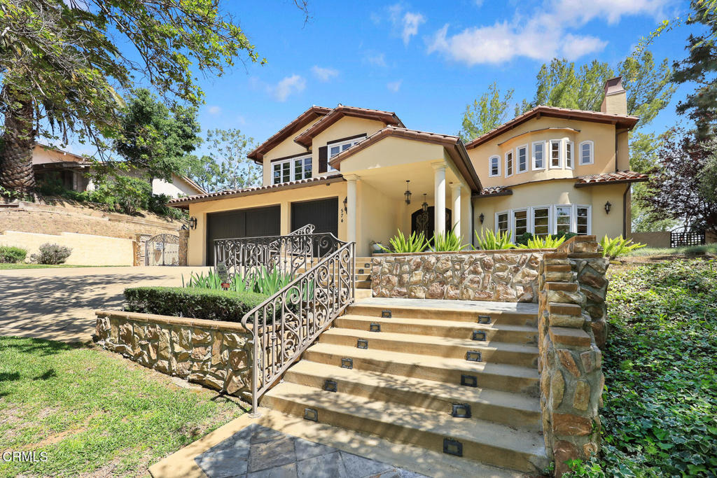574 Camillo Road Sierra Madre, CA 91024 - Photo 3 of 72 a front view of a house with a yard