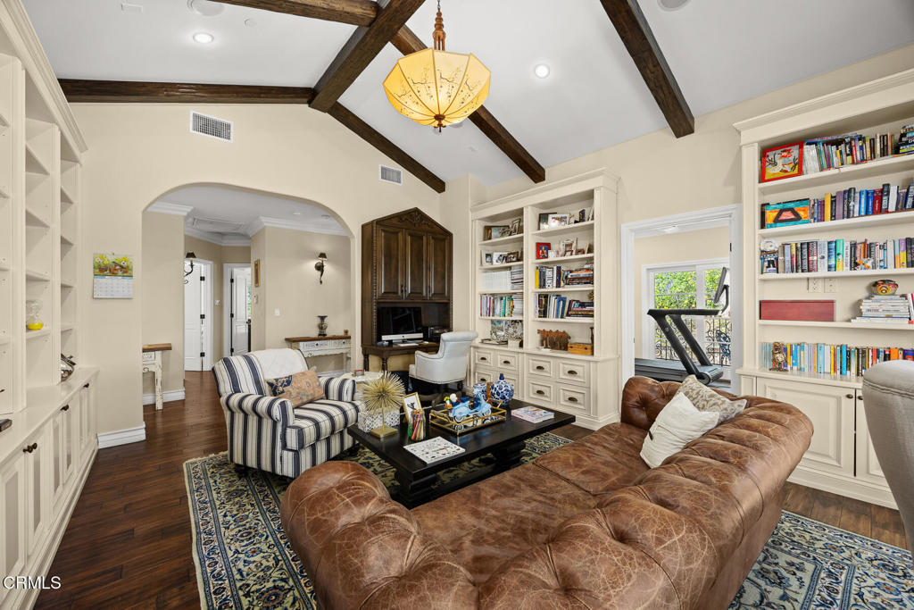 574 Camillo Road Sierra Madre, CA 91024 - Photo 34 of 72 a living room with furniture a bookshelf and a chandelier