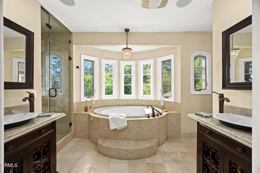 574 Camillo Road Sierra Madre, CA 91024 - Photo 40 of 72 a spacious bathroom with a tub a sink and large mirror