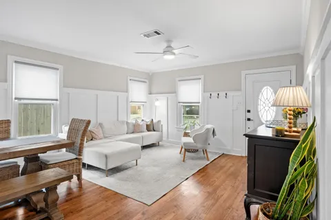 a living room with furniture rug and window