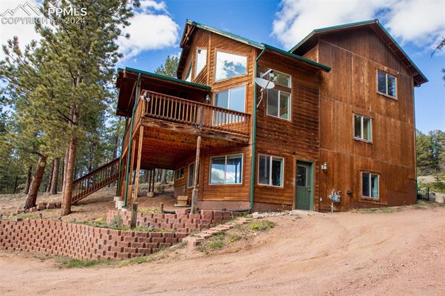 398 Pinewood Road Florissant, CO 80816 - Photo 41 of 43 Back of property featuring a deck