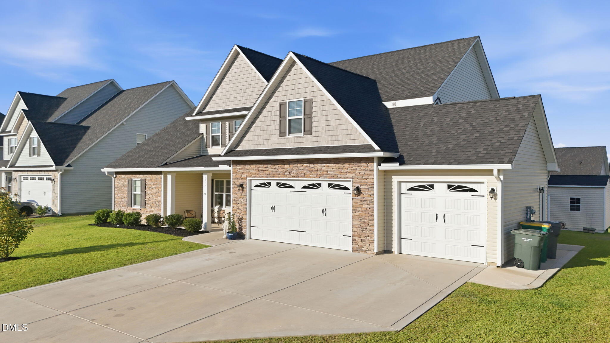 3017 Branscombe Road Fayetteville, NC 28304 - Photo 42 of 43 a front view of a house with a yard and garage