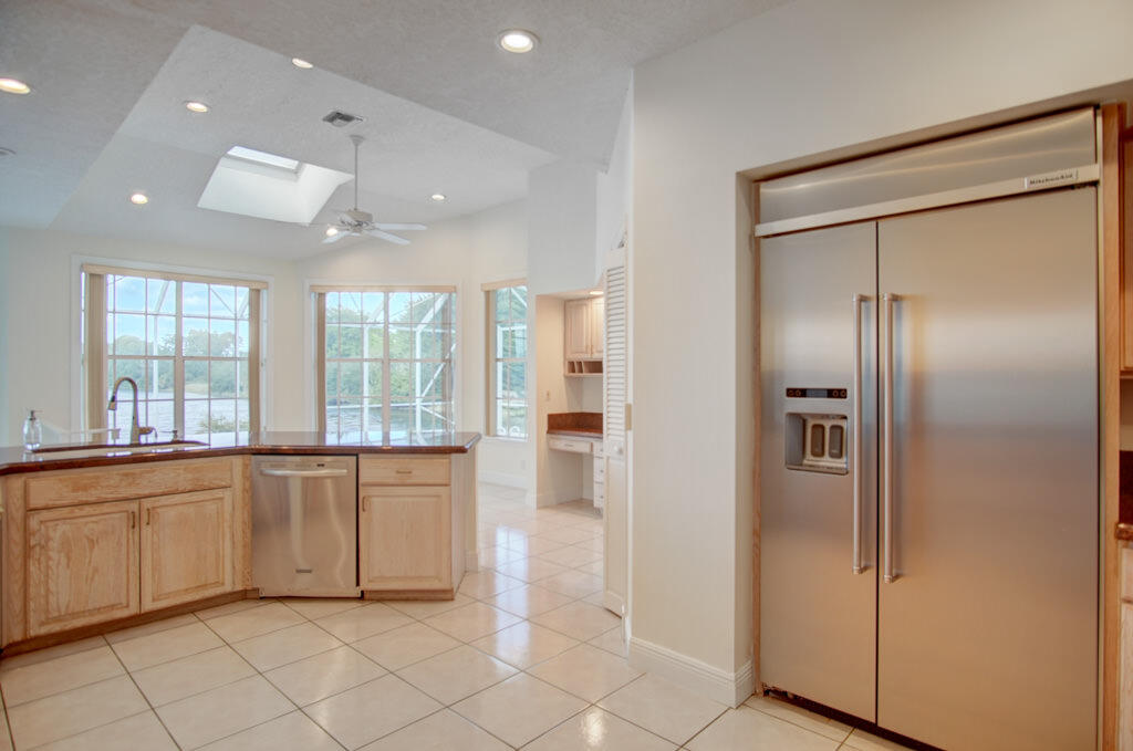 1823 Southwest 17th Street Boca Raton, FL 33486 - Photo 22 of 67 a large kitchen with cabinets and a refrigerator